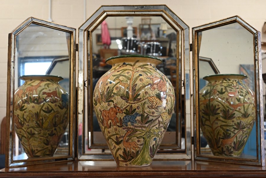 A Zimbabwean pottery large vase, richly painted with wildlife