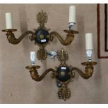 A pair of Empire style twin-branch wall lights