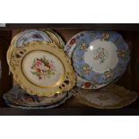 A quantity of floral decorated and gilded pottery and china plates and dishes