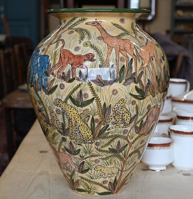 A Zimbabwean pottery large vase, richly painted with wildlife - Image 2 of 3