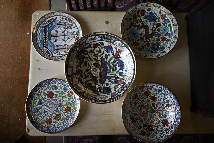Three Greek pottery bowls and two plates