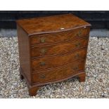 A 'Bevan Funnell Ltd Reprodux' serpentine front walnut chest of four long graduating drawers