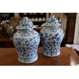 A pair of modern Chinese blue and white vases and covers