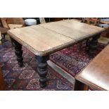 A late Victorian oak dining table