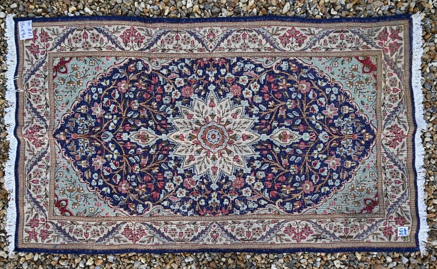 A Persian Kerman rug - Image 2 of 2