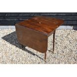 A 19th century mahogany drop leaf dining table