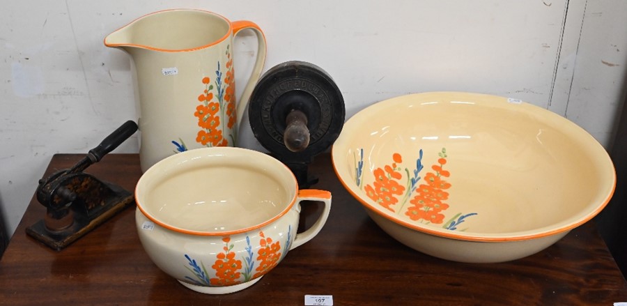 A Myott & Sons pottery ewer, basin and chamber-pot set, painted with flowers to/w two cast iron stam
