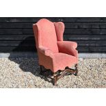 A late Victorian wingback arm chair