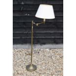 A brass reading lamp with adjustable arm