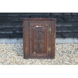 A 19th century oak hanging corner cupboard