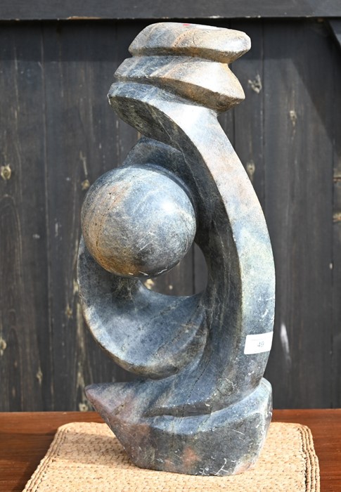 An African carved stone abstract sculpture, 47 cm high