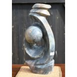 An African carved stone abstract sculpture, 47 cm high