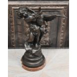 A bronzed group of a putto fighting a duck, on marble base