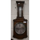 An antique oak barometer