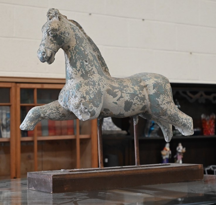 A terracotta sculpture of a horse