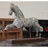 A terracotta sculpture of a horse