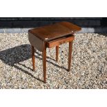 An Edwardian mahogany drop leaf hall table