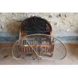 A cast iron fire basket and spark guard