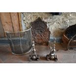 A pair of cast iron fire dogs, fire back and spark guard (3)