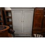A Continental grey painted armoire