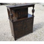 A 17th century style lunette and linenfold carved oak court cupboard