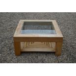 A modern light oak square coffee table