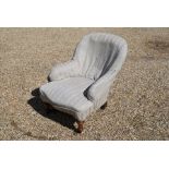 A Victorian serpentine armchair