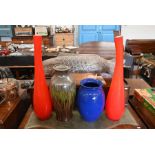 A large pair of red cased glass bottles and two ceramic vases