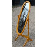 A modern beech framed oval cheval mirror