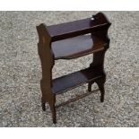 A mahogany inlaid magazine rack and coffee table