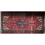 A Persian Hamadan rug, 200 cm x 102 cm