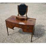 A 19th century mahogany bowfront dressing table
