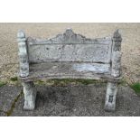 A weathered cast concrete 1930s garden bench in six sections