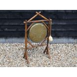 A brass dinner gong on bamboo frame
