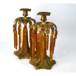 A pair of early 19th century French gilt metal candlesticks