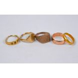 Four various old gold rings