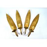 A set of four single arm wall sconces in the form of palm leaves