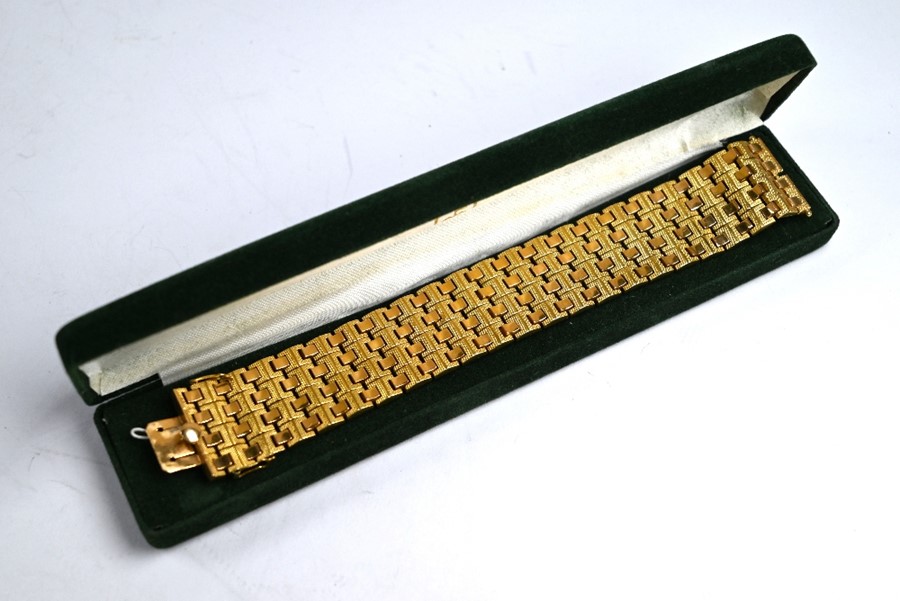 A yellow metal brick-link bracelet