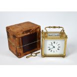 A rectangular lacqured brass cased carriage clock with white enamelled dial