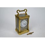 A brass cased carriage clock