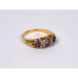 An amethyst and diamond claw set ring