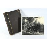 A Victorian album containing a quantity of photographs