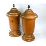 A large pair of turned pine table lamp bases, approx. 32 cm dia. x 56 cm h