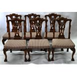 A set of six George II style carved and moulded mahogany dining side chairs