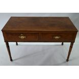 A Victorian oak two drawer side table, raised on turned legs