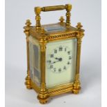 A miniature brass cased aesthetic style carriage clock