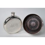 Silver hip flask and bottle coaster