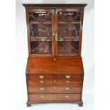 A George III mahogany astragal glazed library bureau bookcase