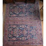 A companion pair of antique Persian Kashan rugs, circa 1920s