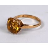 A 9ct yellow gold ring set with circular citrine